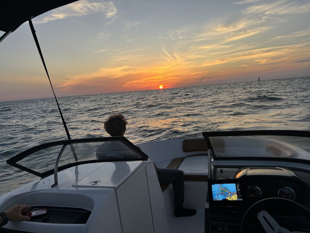 Captain Ridge drives during golden hour on a St. Pete Sun Cruise sunset tour.