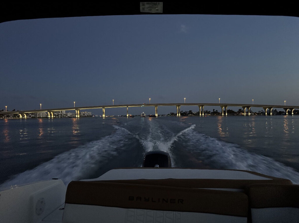 A St. Pete Sun Cruise boat glides across Tampa Bay under calm skies.